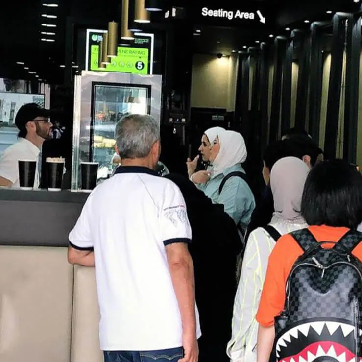 people waiting for their turn in thirty nine desserts place